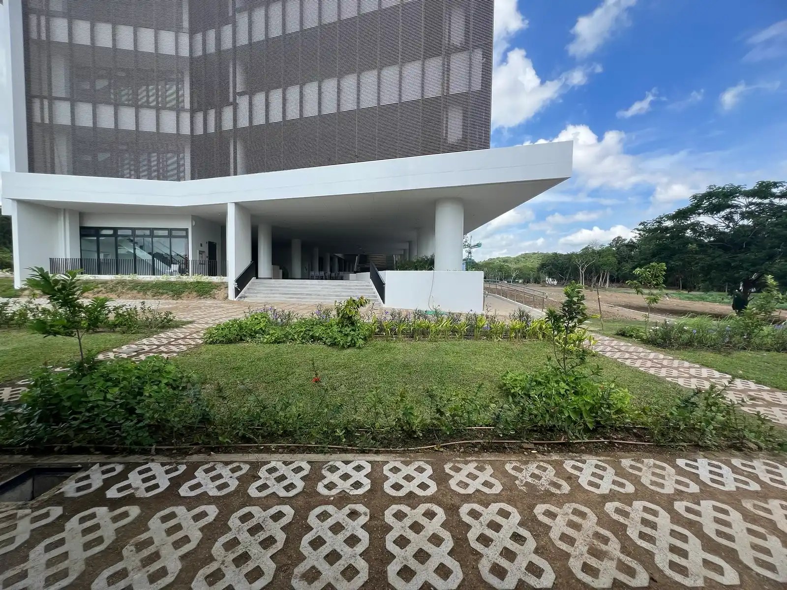 Entrance lawn and flower bed planting at De La Salle University Laguna Campus