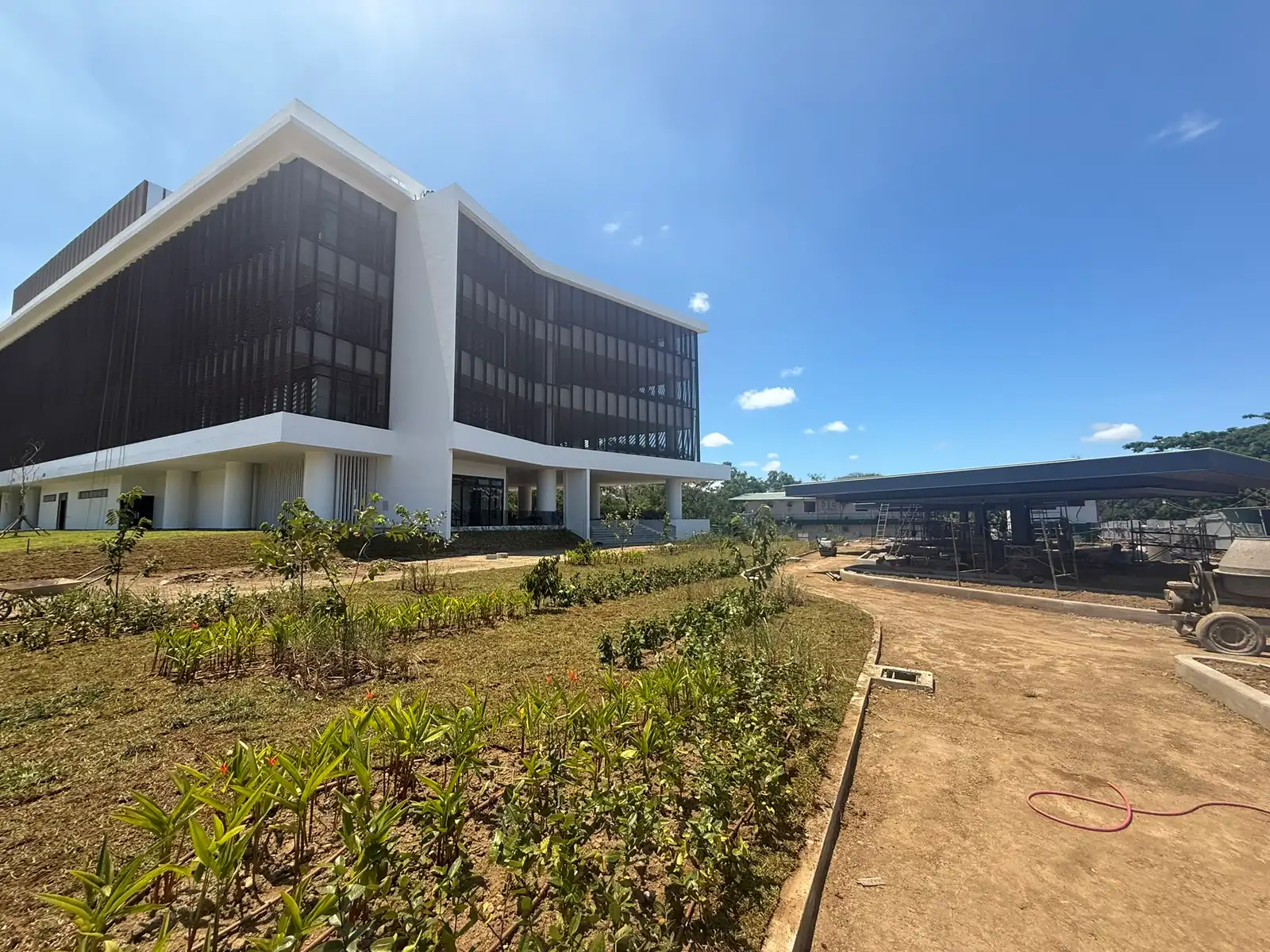 Established lawn and brick plaza landscaping at De La Salle University Laguna Campus