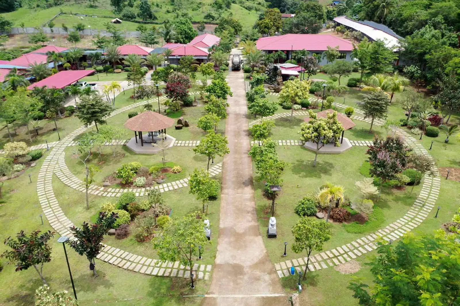 Aerial view of a mandala-pattern stepping-stone garden with gazebos at a resort