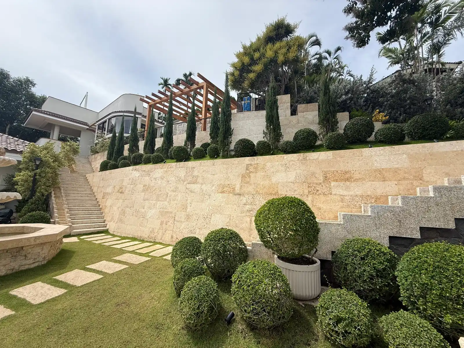 Grand stone stairway framed by tropical planting at a Punta Fuego estate