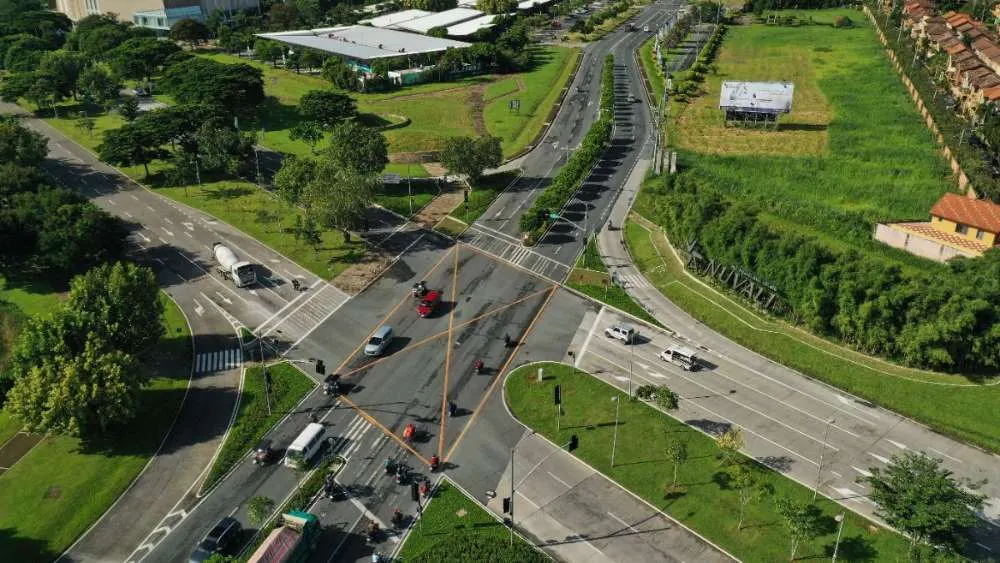 Aerial view of the Nuvali gateway intersection with avenue trees and landscaped medians