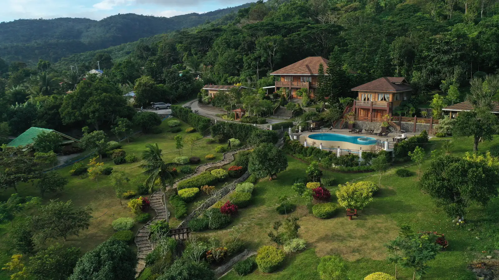 Aerial view of a private resort estate landscape design with pool at sunset, San Pablo, Laguna